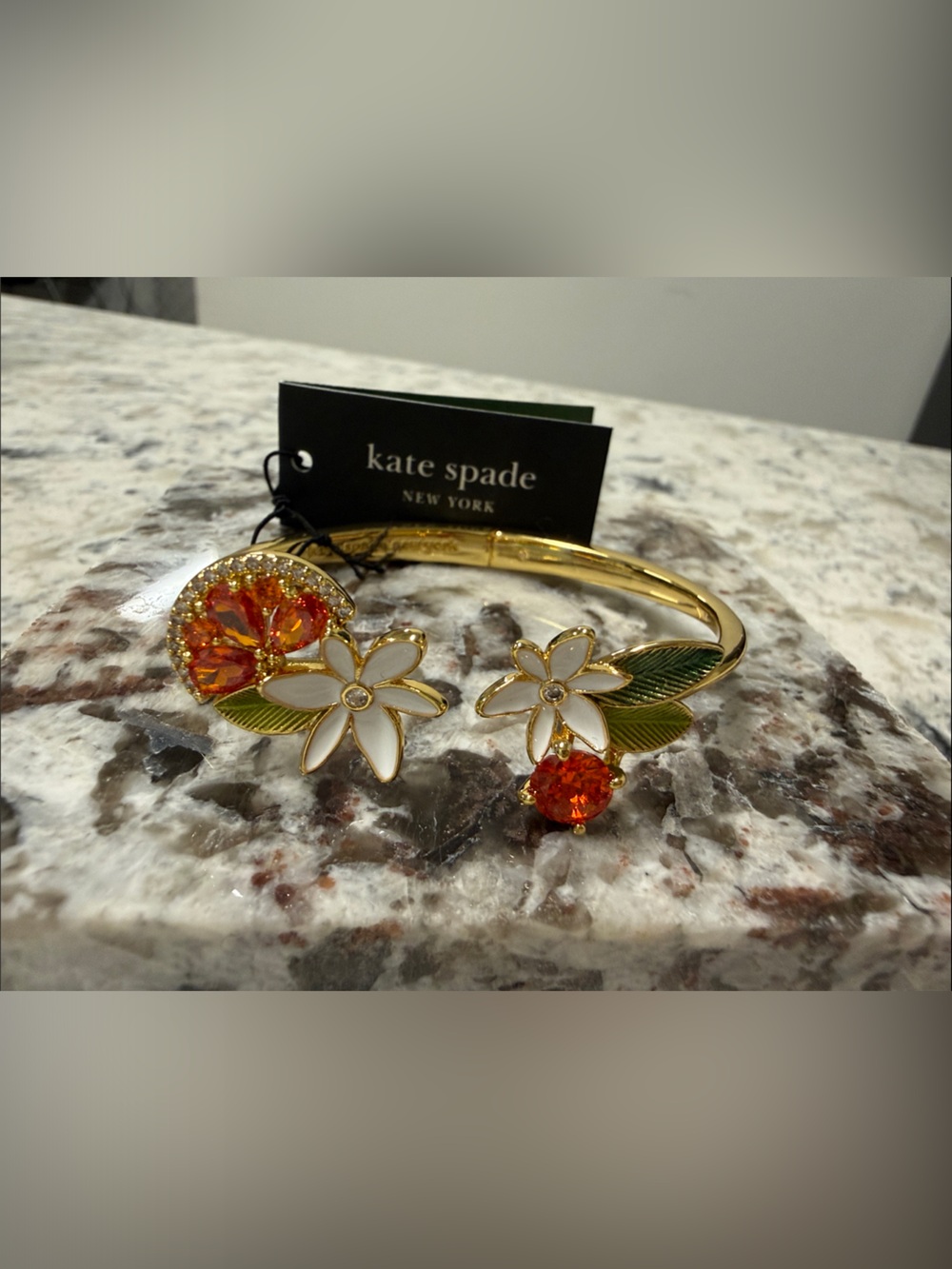 kate spade gold citrus bangle with white enamel and orange crystals